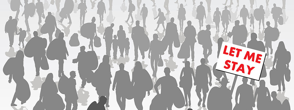 Crowd of displaced people isolated on background with one holding sign with red lettering saying "Let Me Stay"