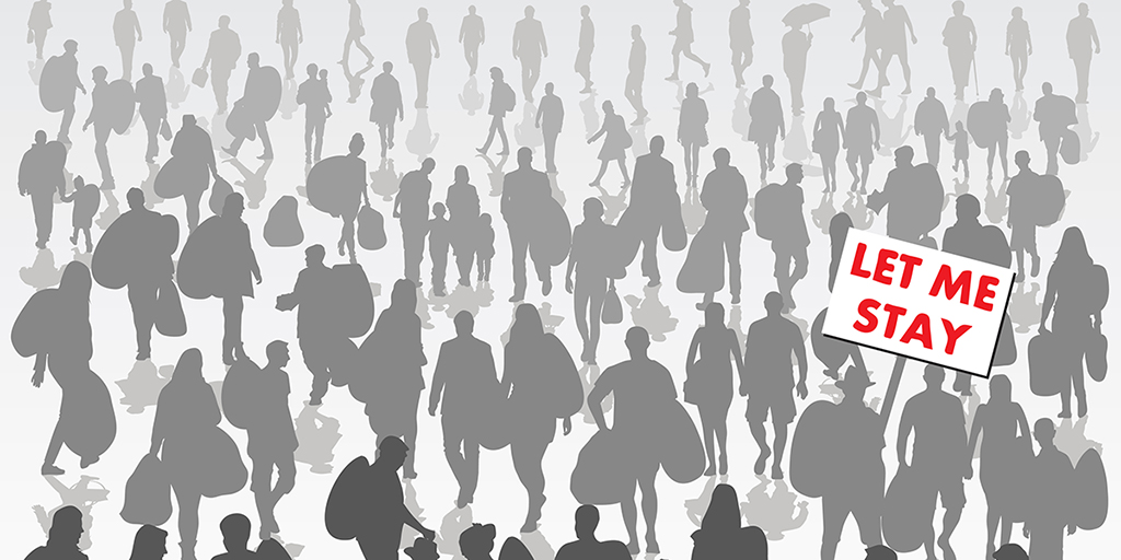 Crowd of displaced people isolated on background with one holding sign with red lettering saying "Let Me Stay"